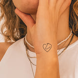 Pferd und Herz Tattoo