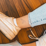 Löwe Konstellation Tattoo