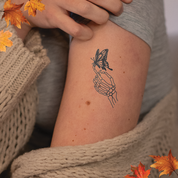 Skeleton Hand with Butterfly Tattoo