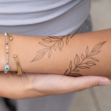 Symmetrische Ornamente Arm Tattoo